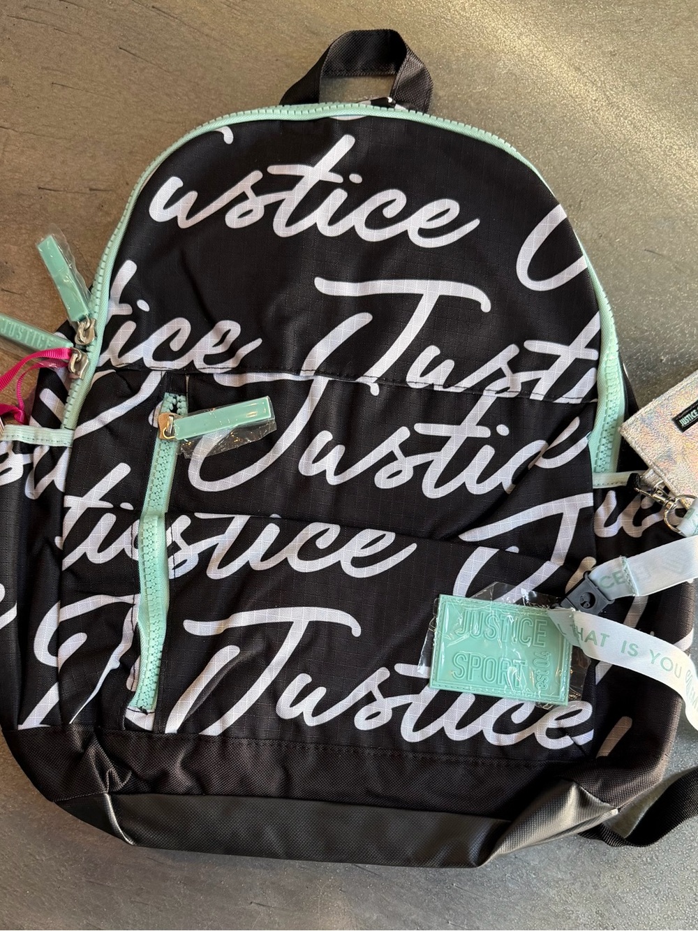 Justice Black Backpack with Mint Accents and Script Logo